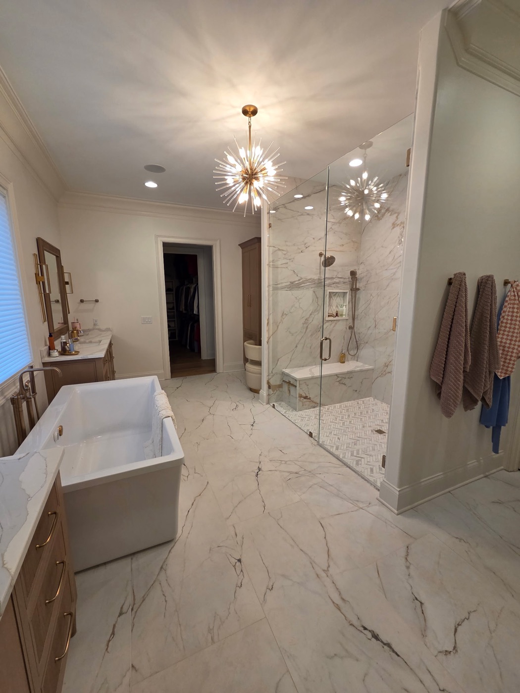 Marble master shower with herringbone floor