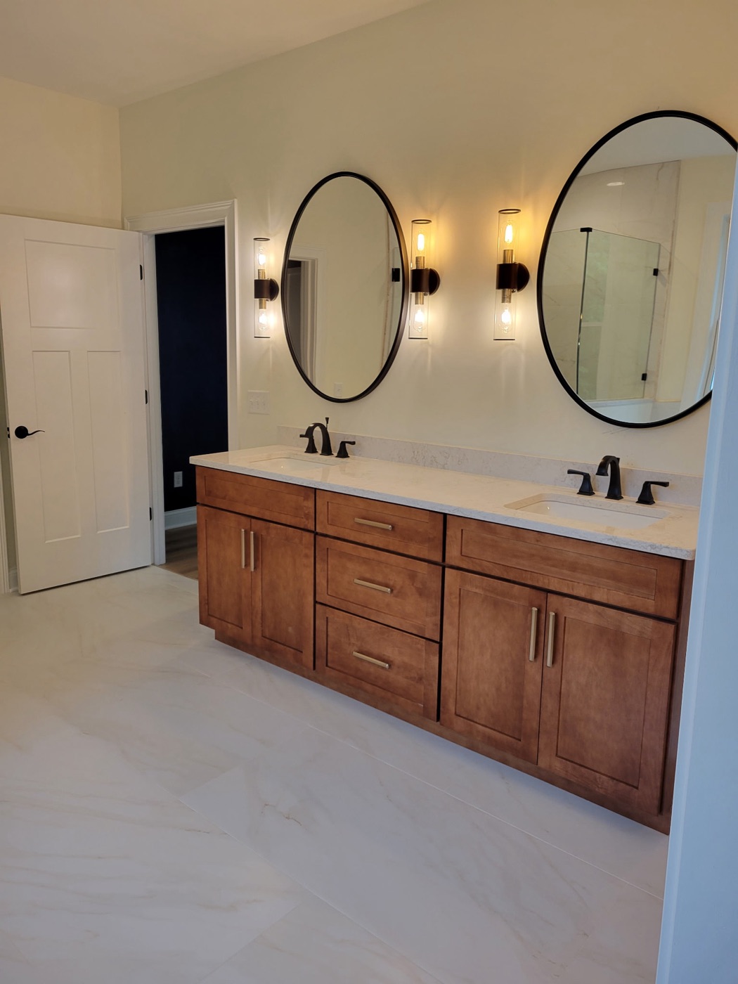 Double wood vanity with round mirrors