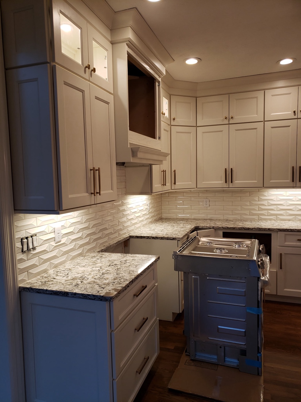 White shaker kitchen with beveled subway backsplash