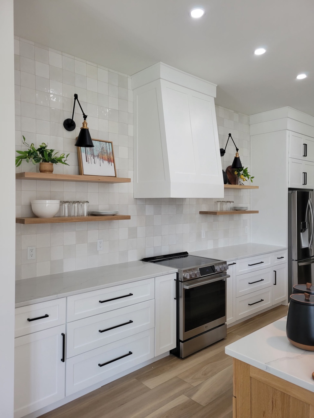 Modern white kitchen with full-height zellige tile