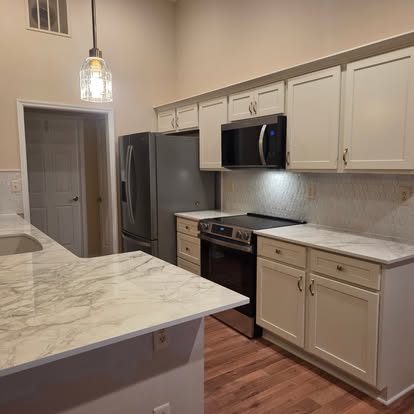 Custom kitchen remodel with marble counters