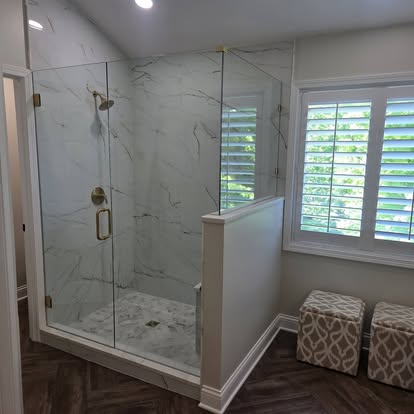 Marble shower with brass fixtures